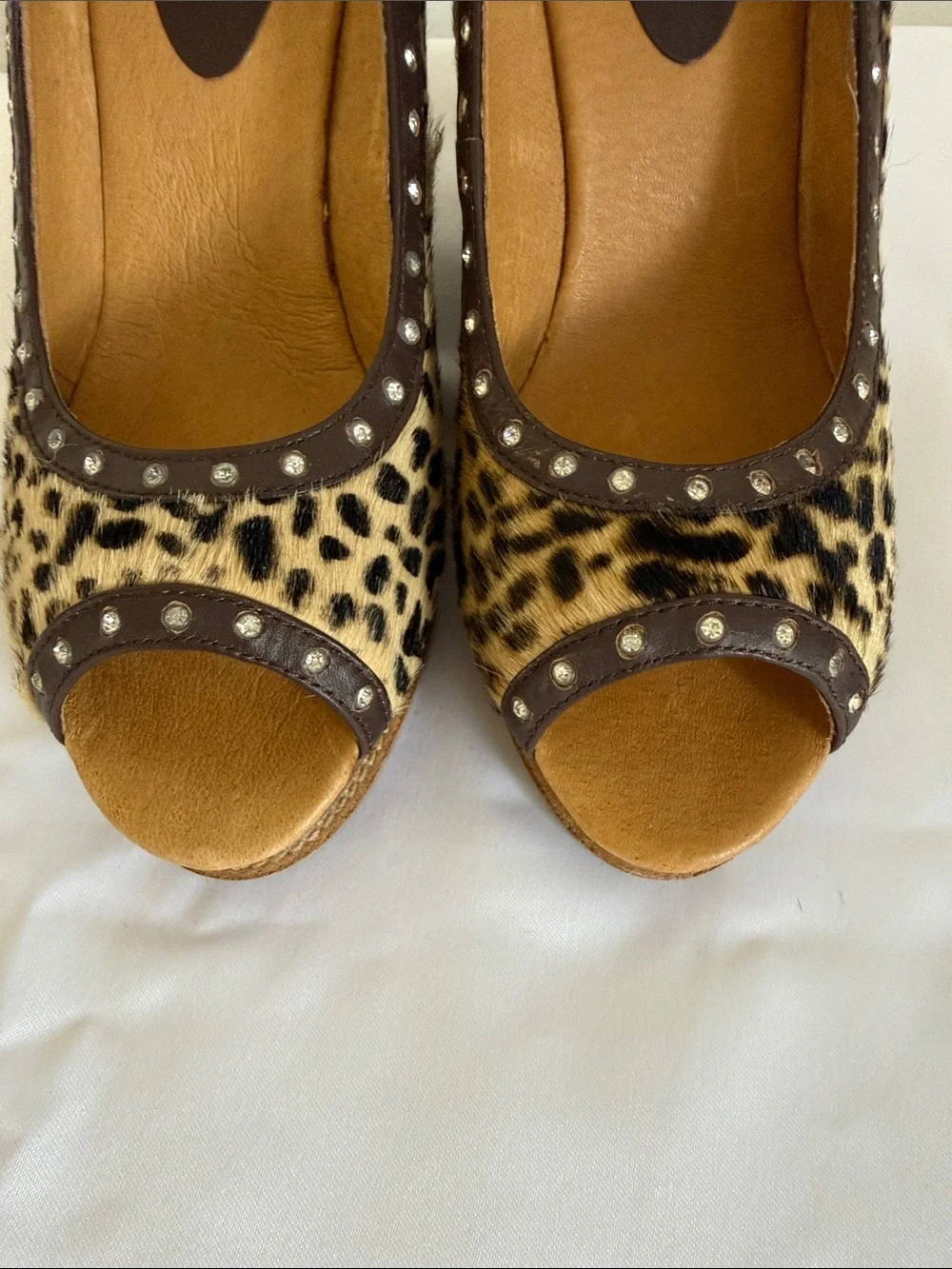 Animal print wedges with rhinestone trim. Leather upper size 8.